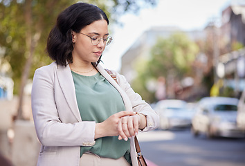 Image showing Time check, travel and a woman in the city for an appointment, early commute and reading notification. Morning, working and a young female employee with a watch for a schedule or agenda in the road