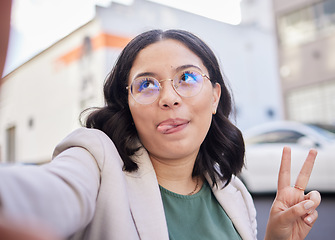 Image showing Business woman, selfie and city with peace sign, funny face or glasses for meme, finance career or street. Employee, outdoor and comic icon for memory, photography or profile picture for social media