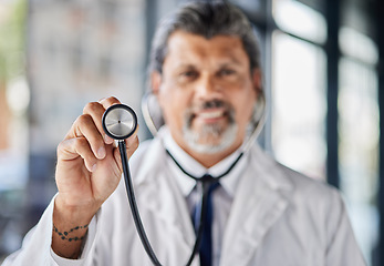 Image showing Man, portrait and doctor with stethoscope for cardiology exam, healthcare service and support or check. Heart, listening and medical professional or senior person with clinic or hospital consultation