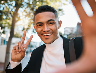 Image showing Selfie, business and portrait of happy man with peace sign in city for social media, profile picture or post. Travel, professional and face of male worker with hand gesture for career, job or success