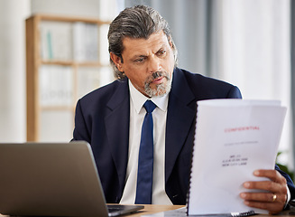 Image showing Lawyer, confidential and paperwork with man reading patient file and documents in office. Compliance, legal report and attorney employee in a law firm with government contract and policy planning