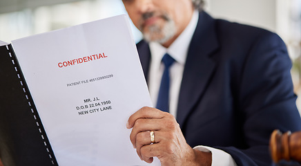 Image showing Lawyer, confidential and paperwork with hands holding patient file and documents in office. Compliance, legal report and attorney employee in a law firm with government contract and policy reading