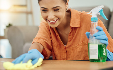 Image showing Spray, woman and smile for cleaning table, furniture and housekeeping services at home. Female cleaner wipe surface with cloth, bottle of chemical product and disinfection of dust, bacteria and dirt