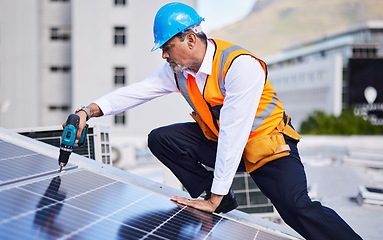 Image showing Solar panels, man and power drill for engineering, grid and building maintenance in city. Electrician, construction tools and inspection of energy saving electricity, photovoltaic system and rooftop