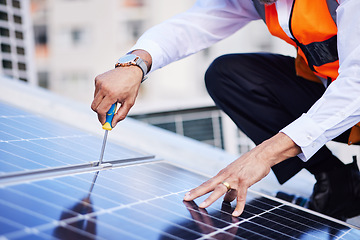 Image showing Solar panels, person hands and screwdriver for engineering maintenance, sustainability and development on rooftop, Industry worker with eco friendly grid, tools and photovoltaic installation in city