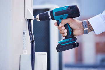 Image showing Drill, air conditioning and hands of electrician outdoor for renovation of building maintenance. Closeup, construction tools and inspection of electricity, mechanic system and power for engineering