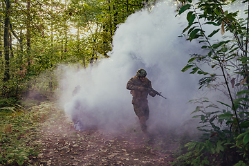 Image showing Battle of the military in the war. Military troops in the smoke