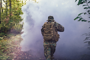 Image showing Battle of the military in the war. Military troops in the smoke