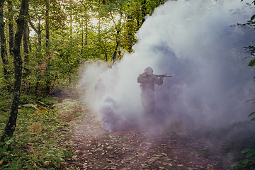 Image showing Battle of the military in the war. Military troops in the smoke