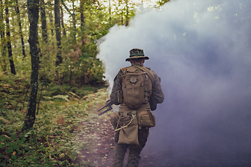 Image showing Battle of the military in the war. Military troops in the smoke