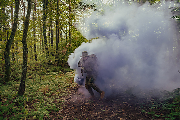 Image showing Battle of the military in the war. Military troops in the smoke