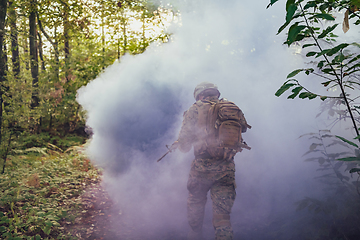 Image showing Battle of the military in the war. Military troops in the smoke