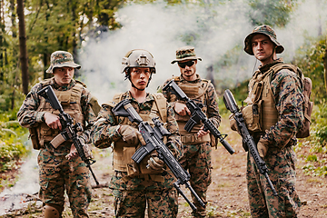 Image showing Modern Warfare Soldiers Squad Running in Tactical Battle Formation Woman as a Team Leader