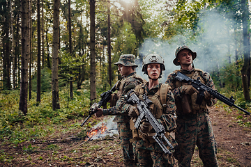 Image showing Modern Warfare Soldiers Squad Running in Tactical Battle Formation Woman as a Team Leader