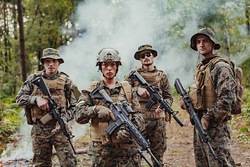 Image showing Modern Warfare Soldiers Squad Running in Tactical Battle Formation Woman as a Team Leader