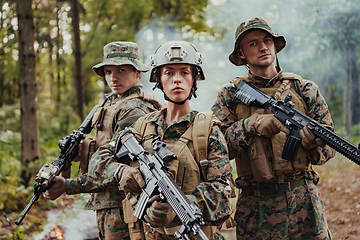 Image showing Modern Warfare Soldiers Squad Running in Tactical Battle Formation Woman as a Team Leader