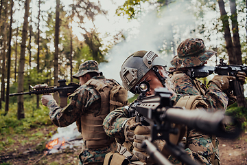 Image showing Modern Warfare Soldiers Squad Running in Tactical Battle Formation Woman as a Team Leader