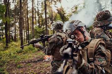 Image showing Modern Warfare Soldiers Squad Running in Tactical Battle Formation Woman as a Team Leader