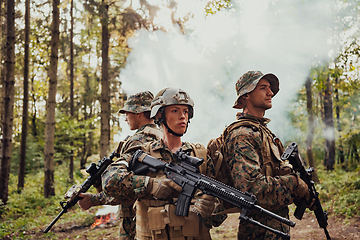 Image showing Modern Warfare Soldiers Squad Running in Tactical Battle Formation Woman as a Team Leader