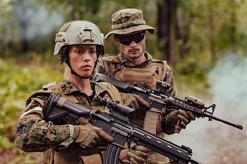 Image showing Modern Warfare Soldiers Squad Running in Tactical Battle Formation Woman as a Team Leader