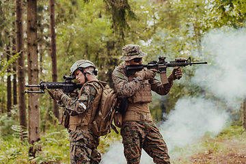 Image showing Modern Warfare Soldiers Squad Running in Tactical Battle Formation Woman as a Team Leader