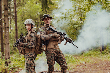 Image showing Modern Warfare Soldiers Squad Running in Tactical Battle Formation Woman as a Team Leader