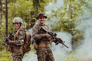 Image showing Modern Warfare Soldiers Squad Running in Tactical Battle Formation Woman as a Team Leader