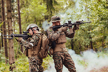 Image showing Modern Warfare Soldiers Squad Running in Tactical Battle Formation Woman as a Team Leader