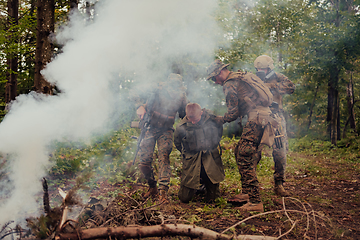 Image showing Soldiers squad was capture alive terrorist and interrogation them on them on special tactics violent way