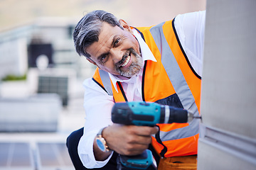 Image showing Solar panels, man and portrait with drill for maintenance of building, power box and upgrade in city. Happy electrician, construction tools and engineering of electrical system, generator and rooftop