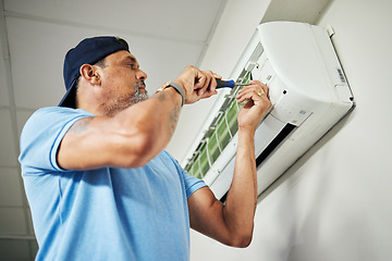 Image showing Electrician, ac repair and air conditioning with man and screwdriver for maintenance, ventilation and power. Engineering, electricity and inspection with technician and tools for fan and contractor