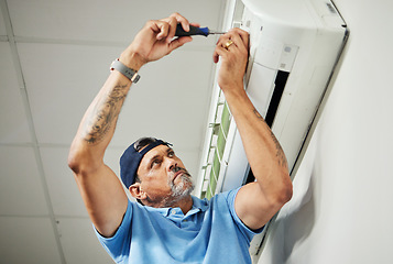 Image showing Electrician, inspection and air conditioning with man and screwdriver for maintenance, ventilation and power. Engineering, electricity and ac repair with technician and tools for fan and contractor