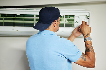 Image showing Man, electrician and ac repair for air conditioner maintenance from the back. Mechanic, technician and engineering tools to fix power of aircon machine, hvac services and check electrical ventilation