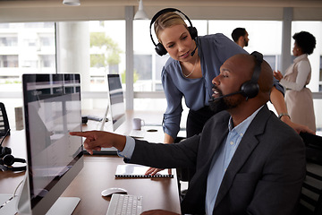 Image showing Call center training, talking and employee with a manager for help, advice or telemarketing work. Diversity, computer and a black man and woman in customer service coaching and discussion at a desk