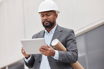 Image showing Tablet, blueprint and an architect manager planning a development project for commercial property. Technology, research and construction with a black man manager reading a floor plan design online