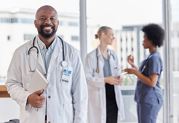 Image showing Happy, portrait and hospital doctor, black man or surgeon team leader smile for healthcare, medical services and clinic help. Medicine expert, tablet and African person for cardiology health support