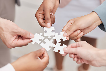 Image showing Business people, hands and puzzle for teamwork, mission and problem solving of challenge, synergy and cooperation. Closeup of employees with jigsaw for integration, collaboration or planning solution