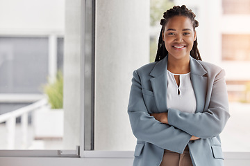 Image showing Portrait, mockup and management with a black woman arms crossed in the office for corporate leadership. Smile, leader and a happy female manager or boss standing in the professional workplace