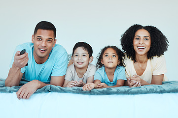 Image showing Father, mother and children on bed, watching tv and smile for comedy, comic movie and cartoon in family home. Happy parents, kids and television show with streaming, subscription and relax together