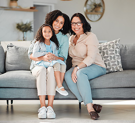 Image showing Mother, grandmother and girl on sofa for portrait in living room, home or happy together for quality time or bonding in house. Smile, face of mama and elderly person to relax with young child