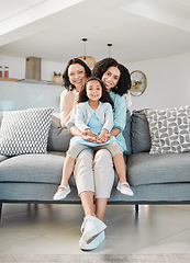 Image showing Grandmother, mother and girl on sofa for portrait in living room, home or happy together for a hug or quality time in house. Smile, face of mom and elderly person relax with young child in embrace