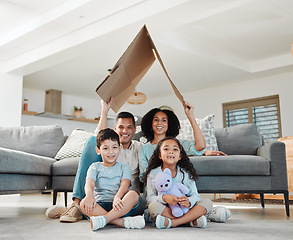 Image showing Cardboard roof, portrait and a family in a lounge for security, safety and shelter as a family. Happy, house and a mother, father and children with refuge in a living room for insurance together