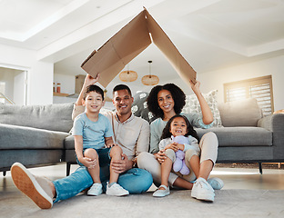 Image showing Cardboard roof, portrait and a family in a home for security, safety and shelter as a family. Happy, house and a mother, father and children with refuge in a living room for insurance together