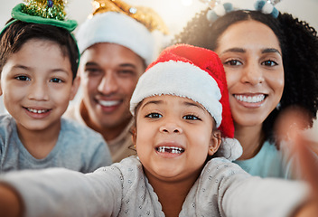 Image showing Parents, kids and christmas selfie in family home, smile and excited for event, culture and celebration together. Mom, dad and young children with xmas memory, photography or profile picture on blog