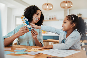 Image showing Homework, education and mother with girl with cards for learning, child development and studying. Family, school and happy mom with kid at table with paper for creative lesson, growth and knowledge