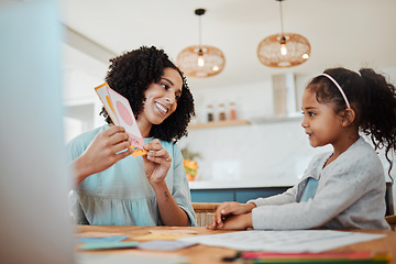 Image showing Homework, learning and mother with girl with card for education, child development and studying. Family, school and happy mom with kid at table with paper for creative lesson, teaching and knowledge