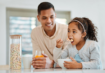 Image showing Eating, morning and a child with father for breakfast, food in the kitchen and care for nutrition. Smile, together and a young dad with a girl kid with cereal in a house for health and hungry