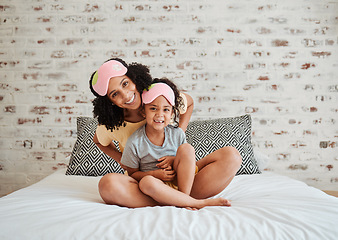 Image showing Portrait, girl and mother with kid in bedroom for quality time in home to relax together with smile. Love, child and mother with happy face in morning for bond or care in apartment with support.