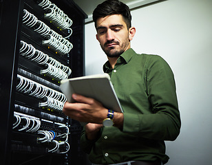 Image showing Engineer man, cable and server room with a tablet for programming, maintenance and software upgrade. Young male technician person with technology in data center for wire, hardware and internet