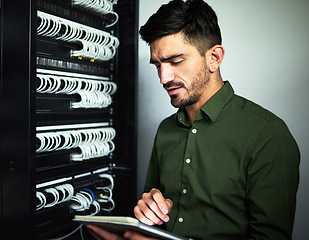 Image showing Engineer man, cable and tablet in server room for programming, maintenance and software upgrade. Serious technician person with technology in data center for wire, hardware and internet connection